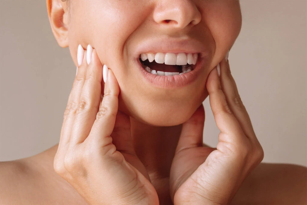 Professional doctor is checking woman's teeth