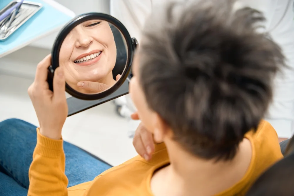 Woman checking Smile during a dental consultation